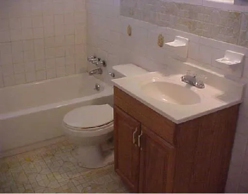 a bathroom with a sink toilet and a bathtub