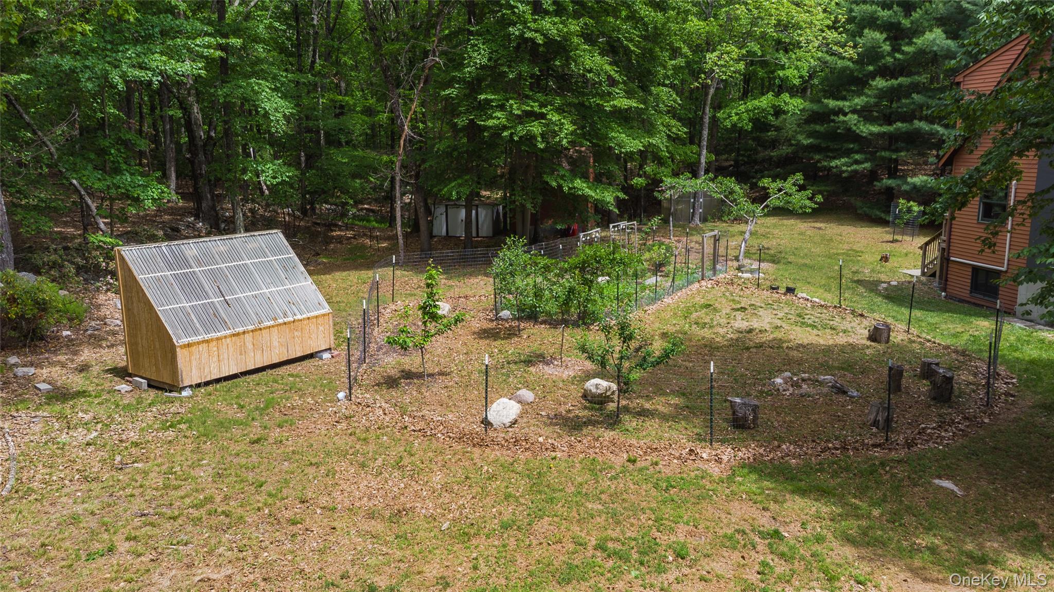 182 Frey Road Pine Bush, NY 12566 - Photo 27 of 33 a view of backyard with plants and outdoor seating