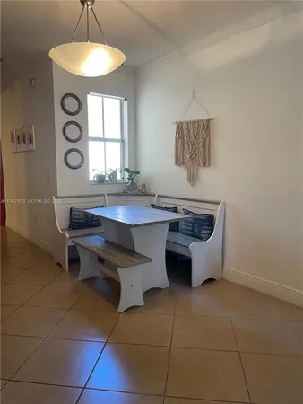 a dining room with a window and a table
