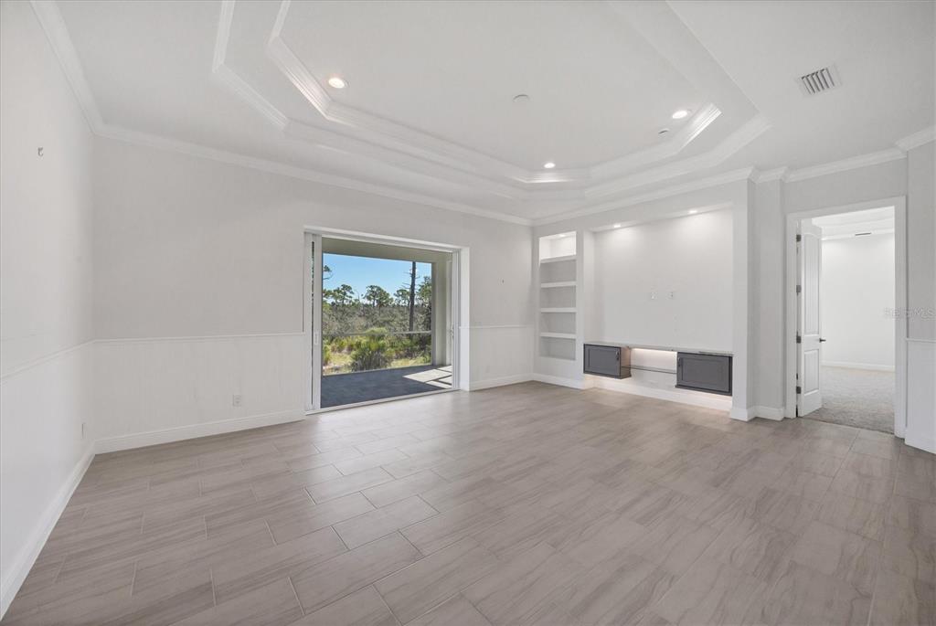 8936 Conch Avenue Placida, FL 33946 - Photo 11 of 39 a view of a livingroom with wooden floor and window