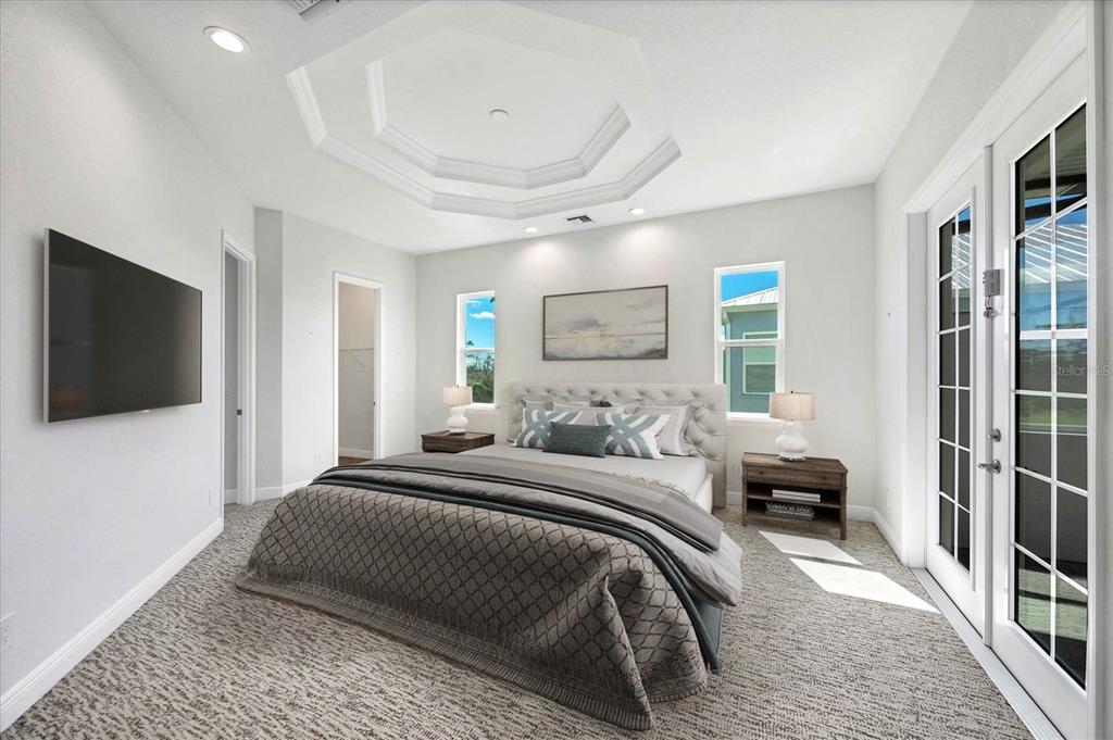 8936 Conch Avenue Placida, FL 33946 - Photo 12 of 39 a bedroom with a bed and a flat screen tv