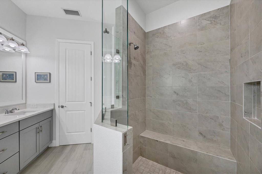8936 Conch Avenue Placida, FL 33946 - Photo 17 of 39 a spacious bathroom with a bathtub shower sink mirror and toilet