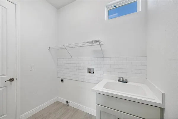a bathroom with a sink and vanity