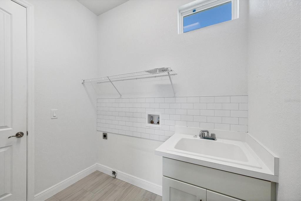 8936 Conch Avenue Placida, FL 33946 - Photo 24 of 39 a bathroom with a sink and vanity