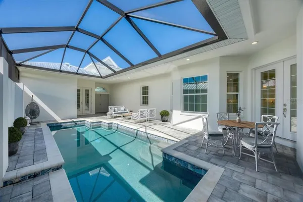 a view of a dinning table and chairs in the patio