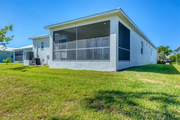 a view of house with backyard