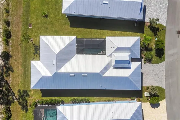 an aerial view of a house with a garden