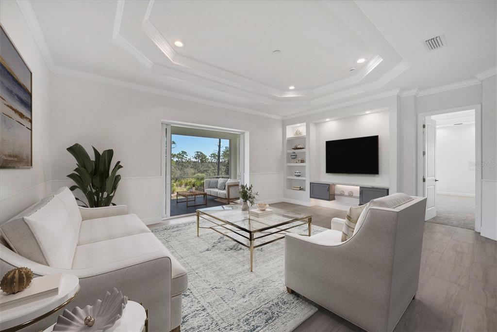 8936 Conch Avenue Placida, FL 33946 - Photo 10 of 39 a living room with furniture and a flat screen tv