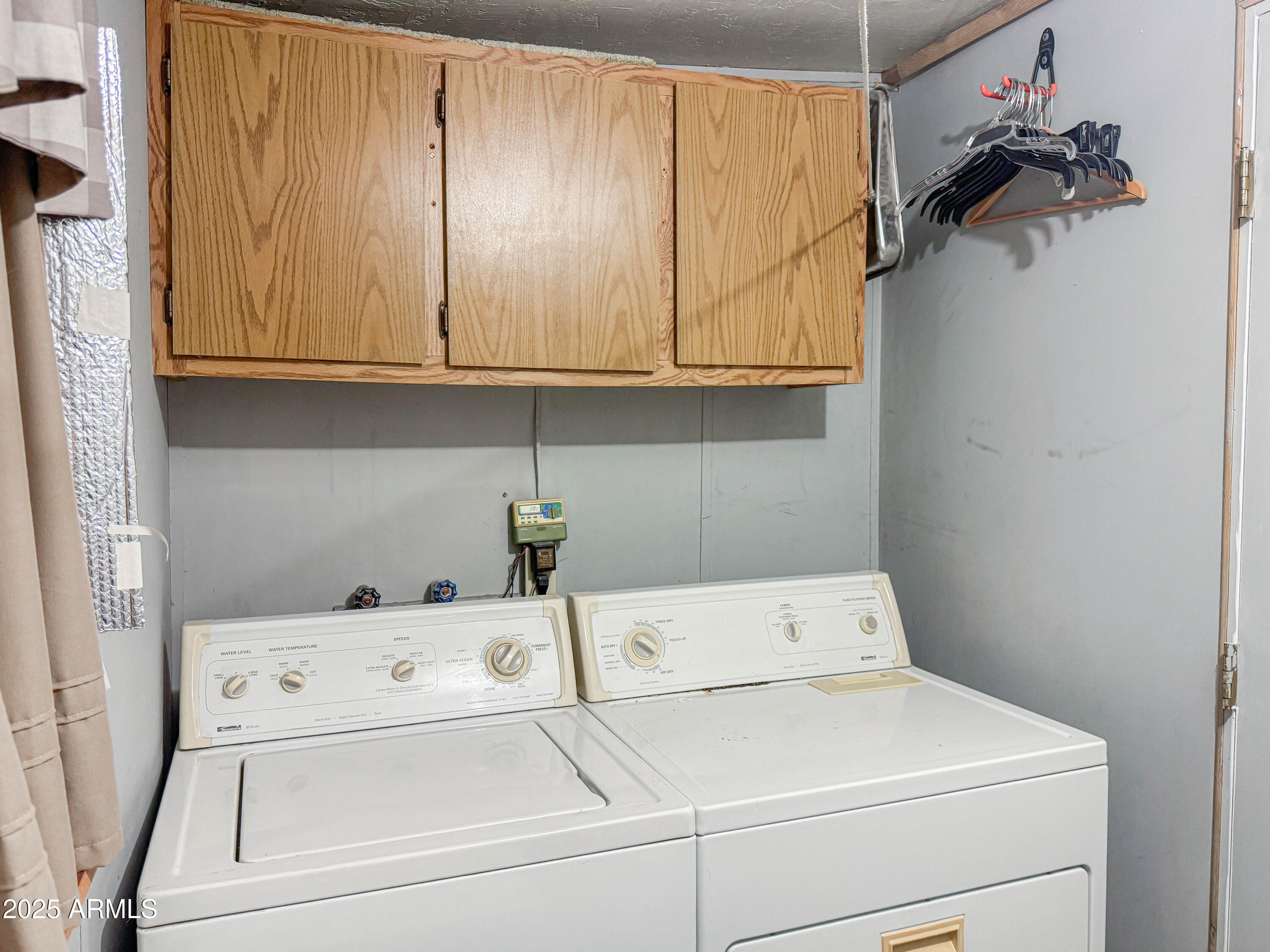 5735 East McDowell Road, Unit 293 Mesa, AZ 85215 - Photo 11 of 40 a utility room with dryer and washer