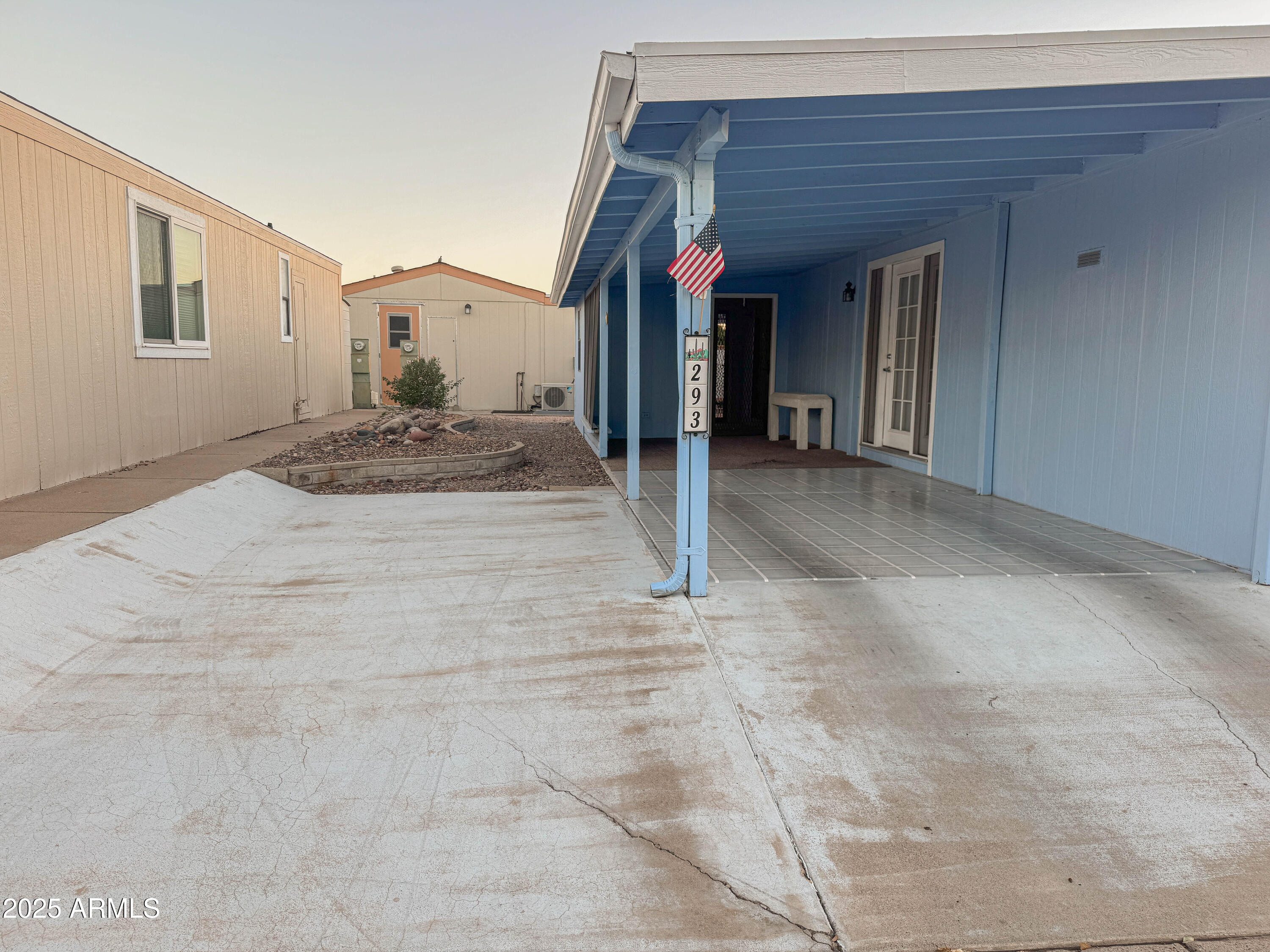 5735 East McDowell Road, Unit 293 Mesa, AZ 85215 - Photo 13 of 40 a view of a house with a patio