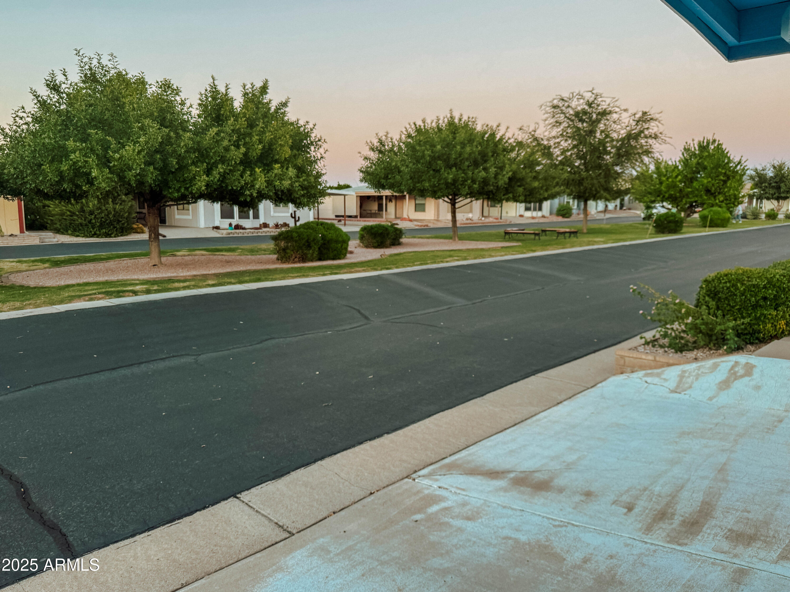 5735 East McDowell Road, Unit 293 Mesa, AZ 85215 - Photo 14 of 40 a view of a swimming pool with a yard and palm trees