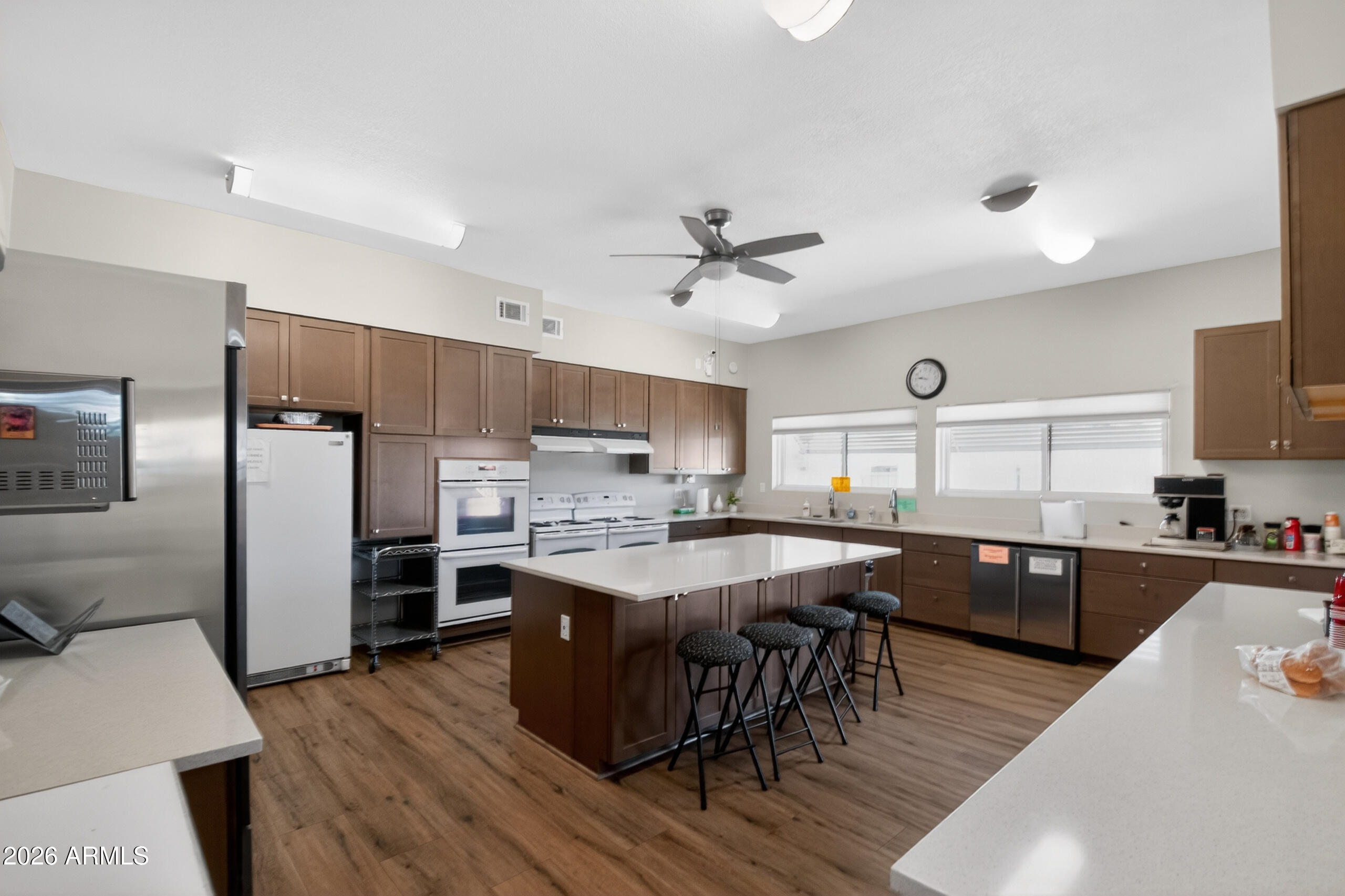 5735 East McDowell Road, Unit 293 Mesa, AZ 85215 - Photo 20 of 40 a kitchen with stainless steel appliances granite countertop a sink stove and refrigerator