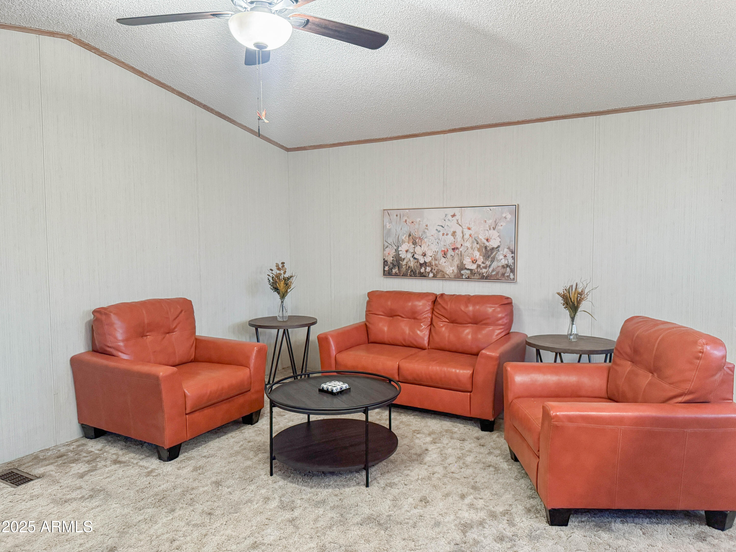 5735 East McDowell Road, Unit 293 Mesa, AZ 85215 - Photo 2 of 40 a living room with furniture and a couch