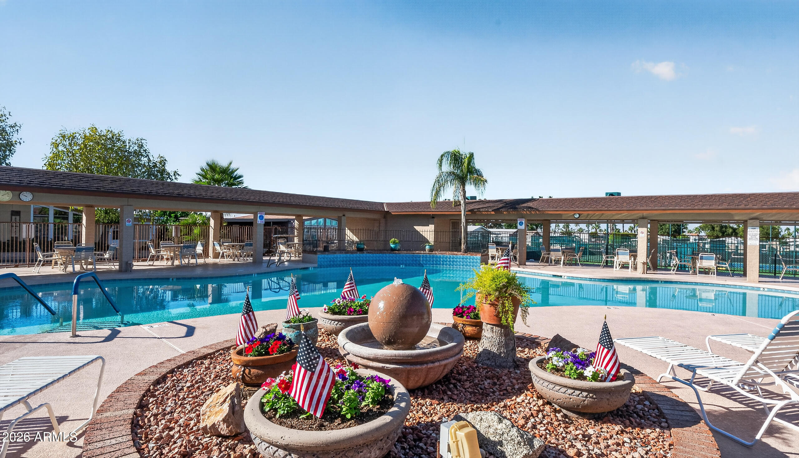 5735 East McDowell Road, Unit 293 Mesa, AZ 85215 - Photo 27 of 40 a view of a patio with couches chairs and potted plants