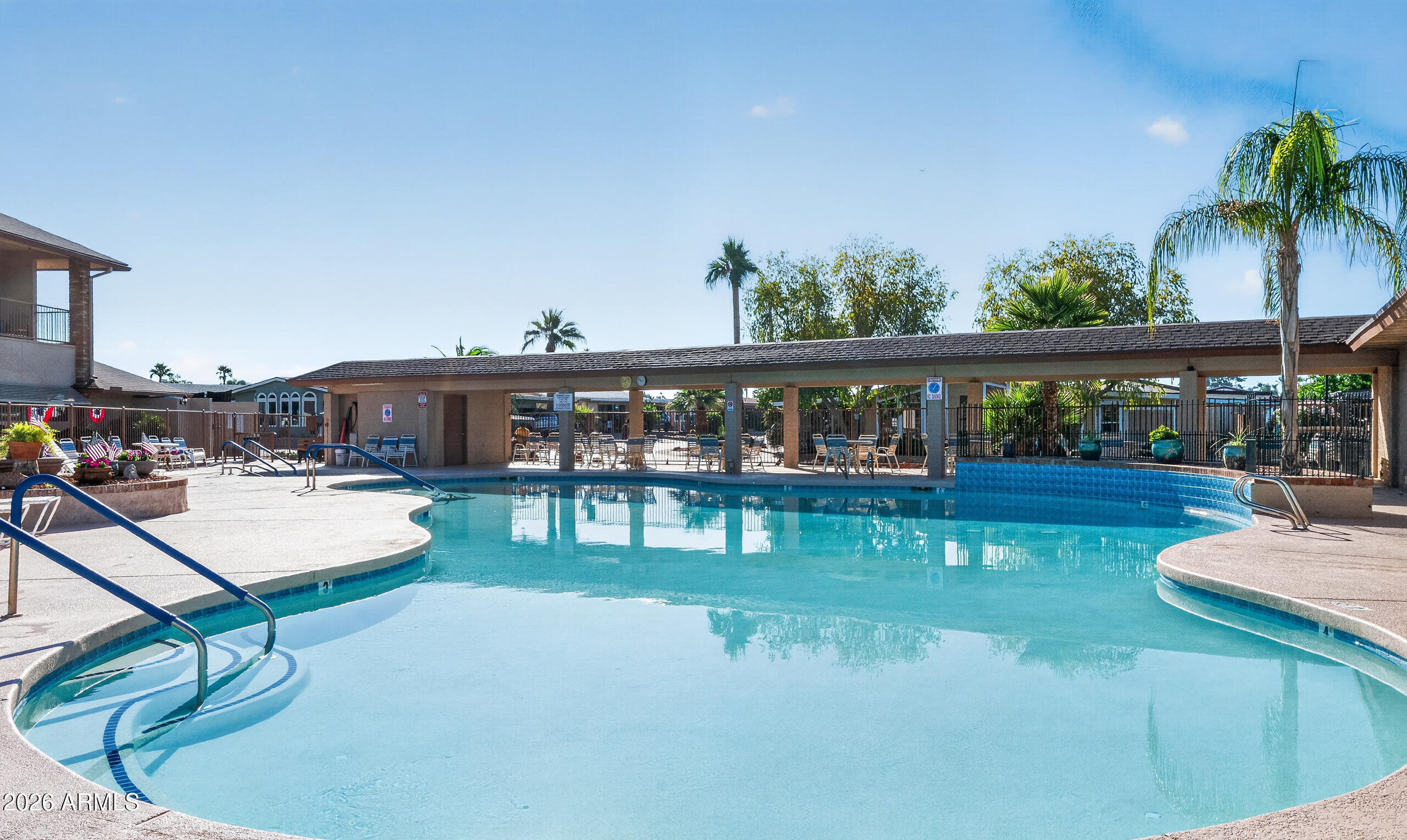 5735 East McDowell Road, Unit 293 Mesa, AZ 85215 - Photo 28 of 40 a view of house with swimming pool and outdoor seating