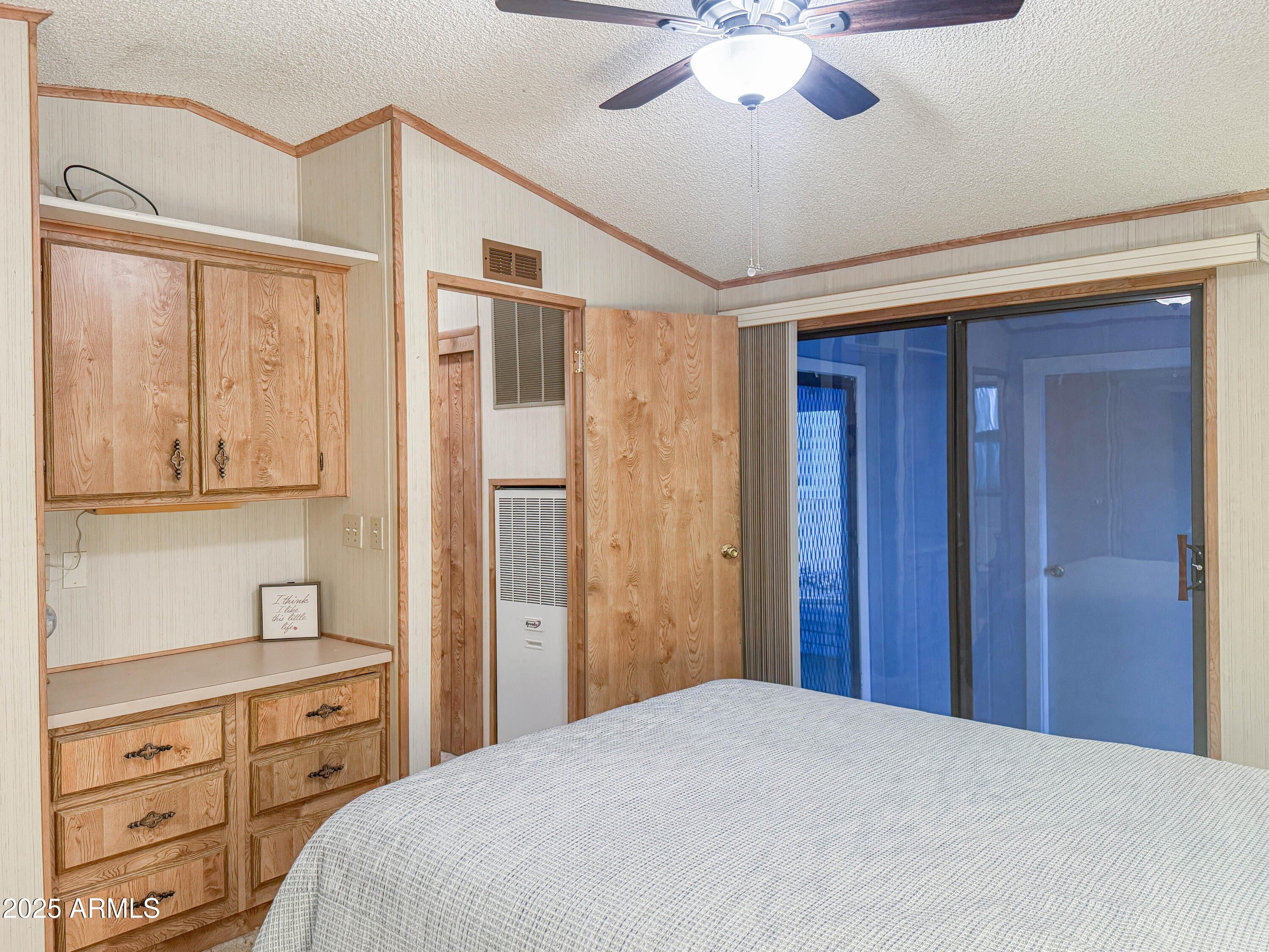 5735 East McDowell Road, Unit 293 Mesa, AZ 85215 - Photo 7 of 40 a bedroom with a bed and a dresser