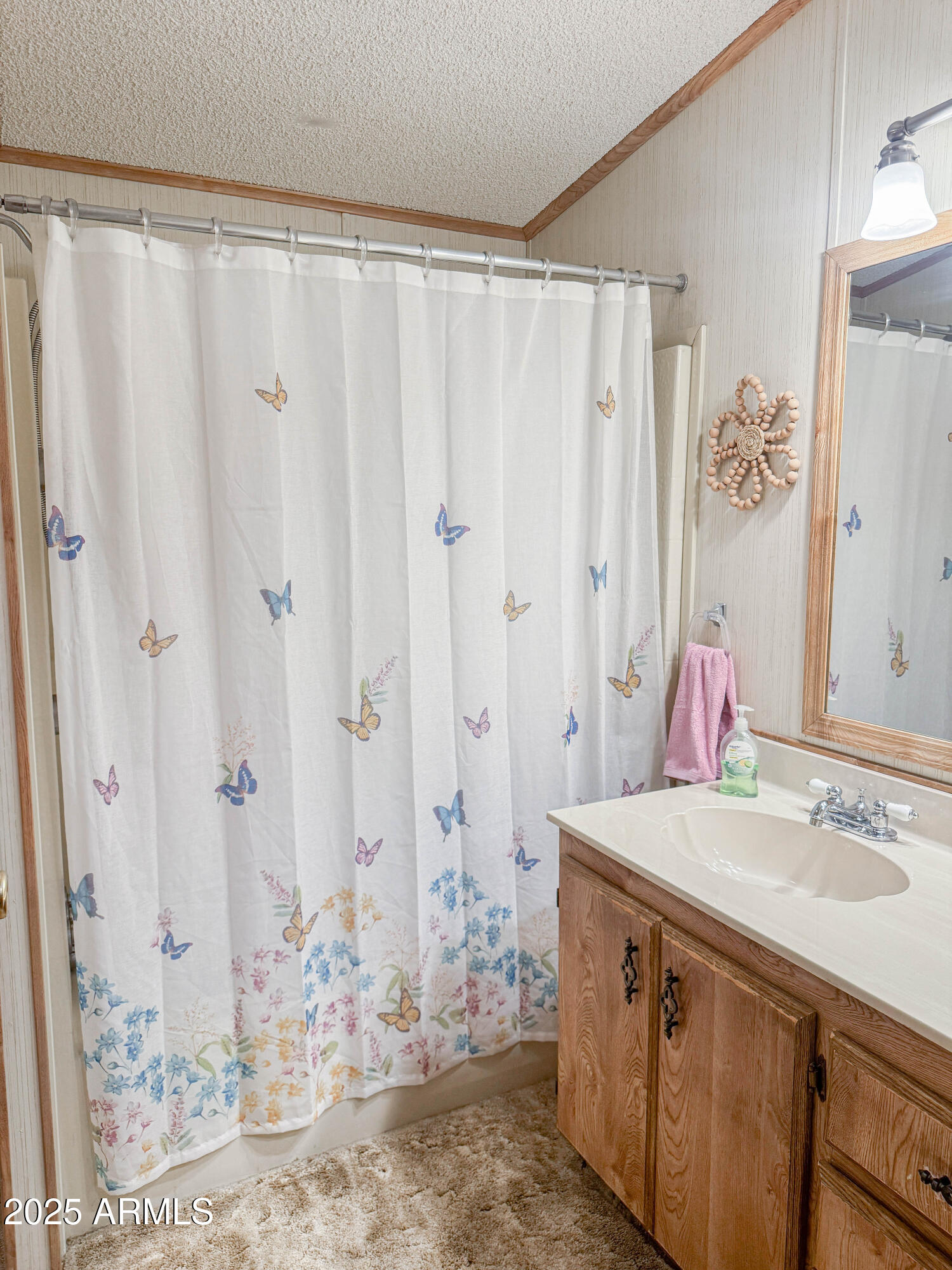 5735 East McDowell Road, Unit 293 Mesa, AZ 85215 - Photo 10 of 40 a bathroom with a sink and a mirror