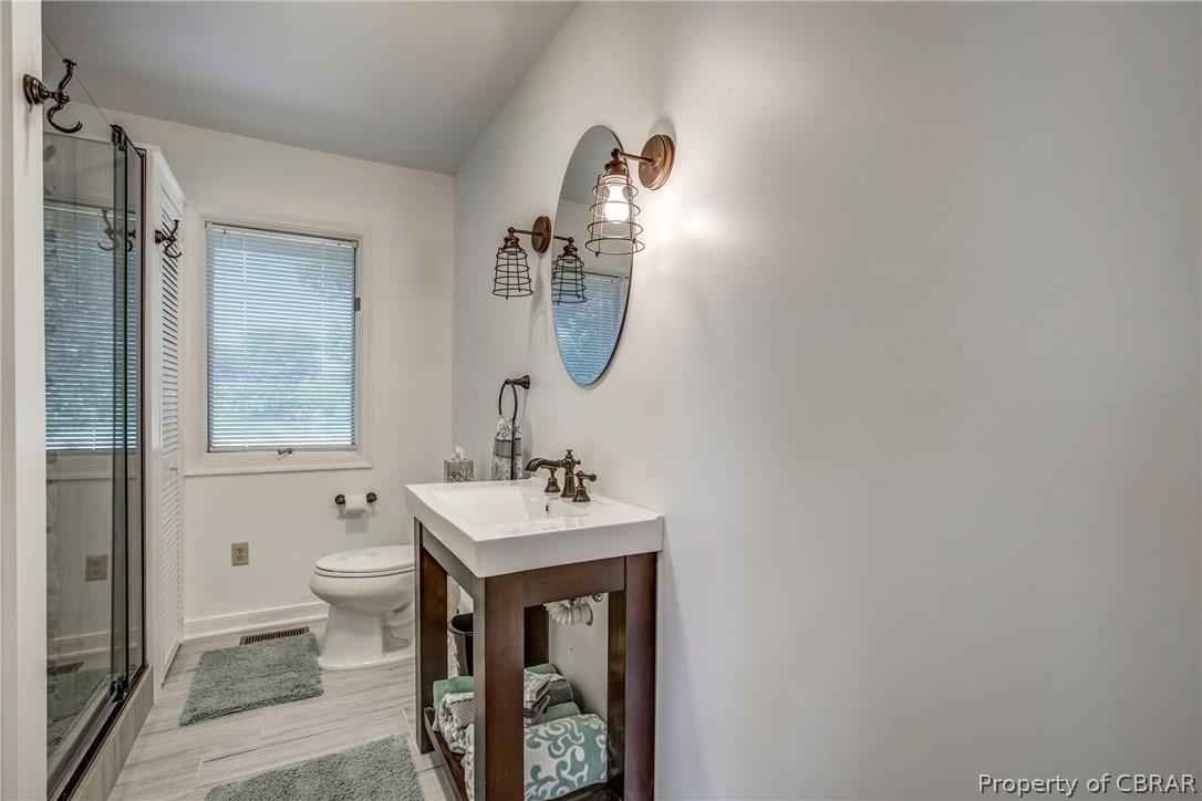 546 Eubank Landing Road Topping, VA 23169 - Photo 20 of 40 New third full bath added in the renovation. Pretty tiled shower.