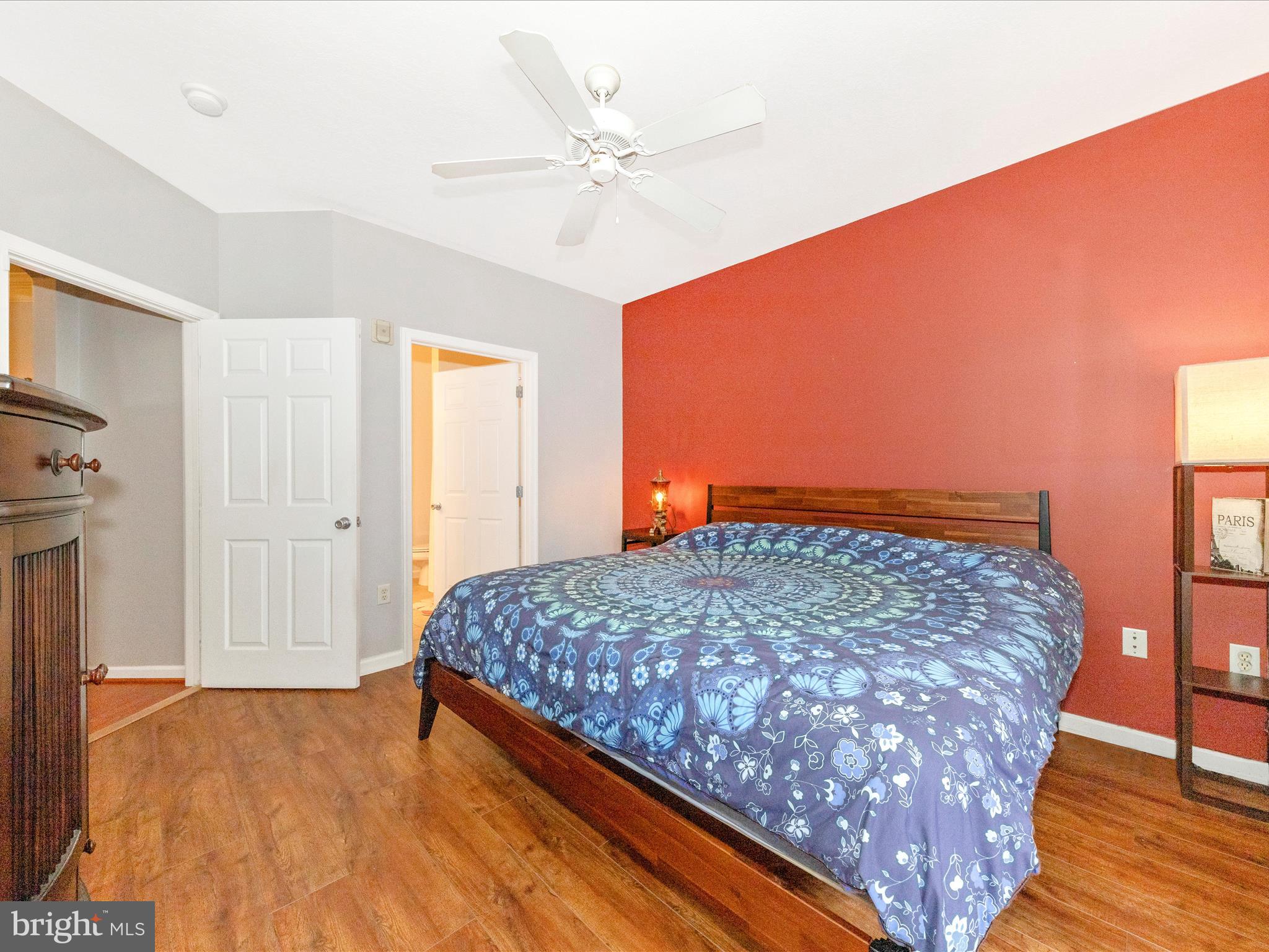 7 Booth Street, Unit 201 Gaithersburg, MD 20878 - Photo 18 of 67 a bedroom with a bed and a chandelier
