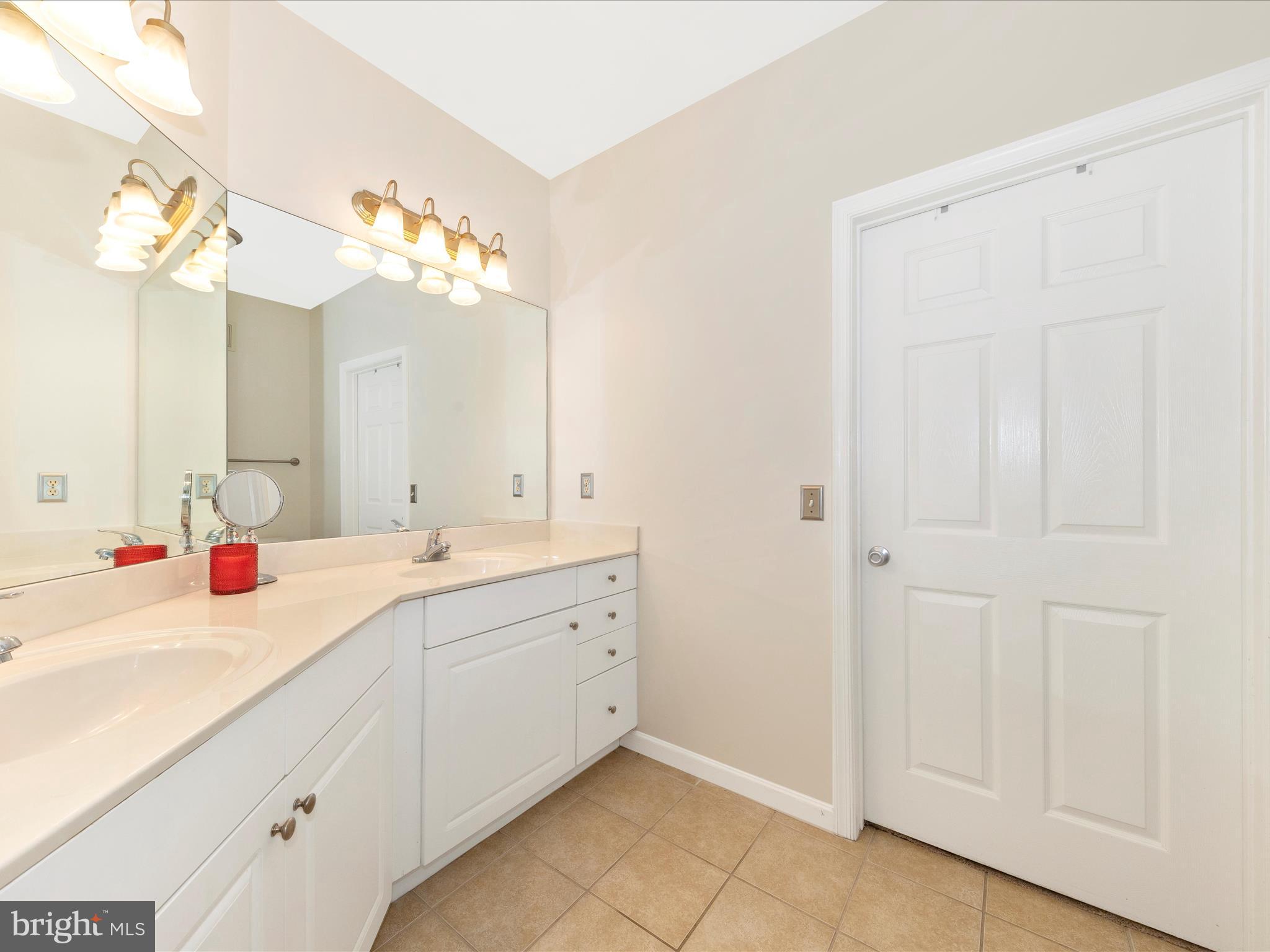7 Booth Street, Unit 201 Gaithersburg, MD 20878 - Photo 20 of 67 a bathroom with a sink and a mirror