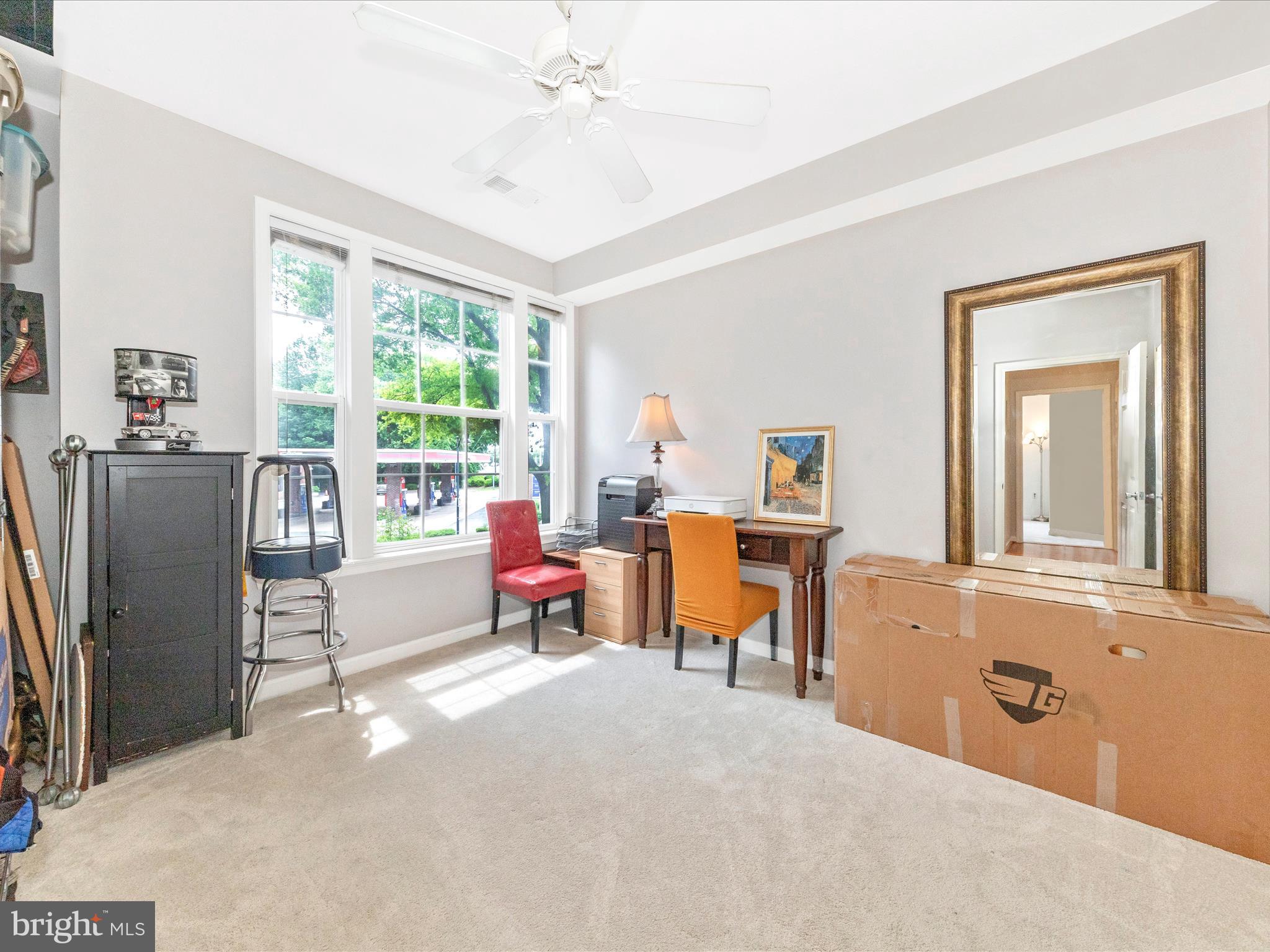 7 Booth Street, Unit 201 Gaithersburg, MD 20878 - Photo 22 of 67 a living room with furniture and a window