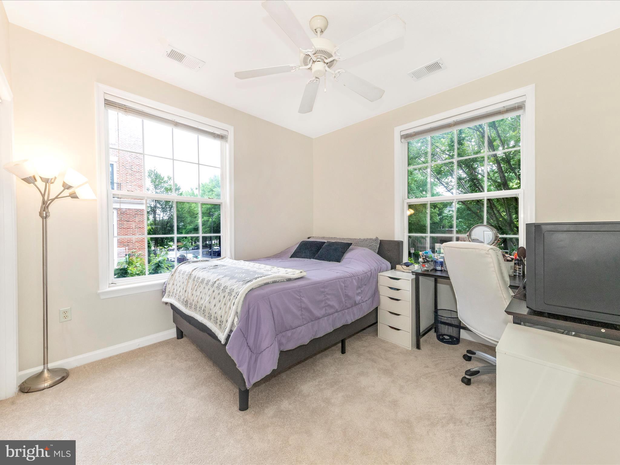 7 Booth Street, Unit 201 Gaithersburg, MD 20878 - Photo 23 of 67 a bed room with a bed and a chair