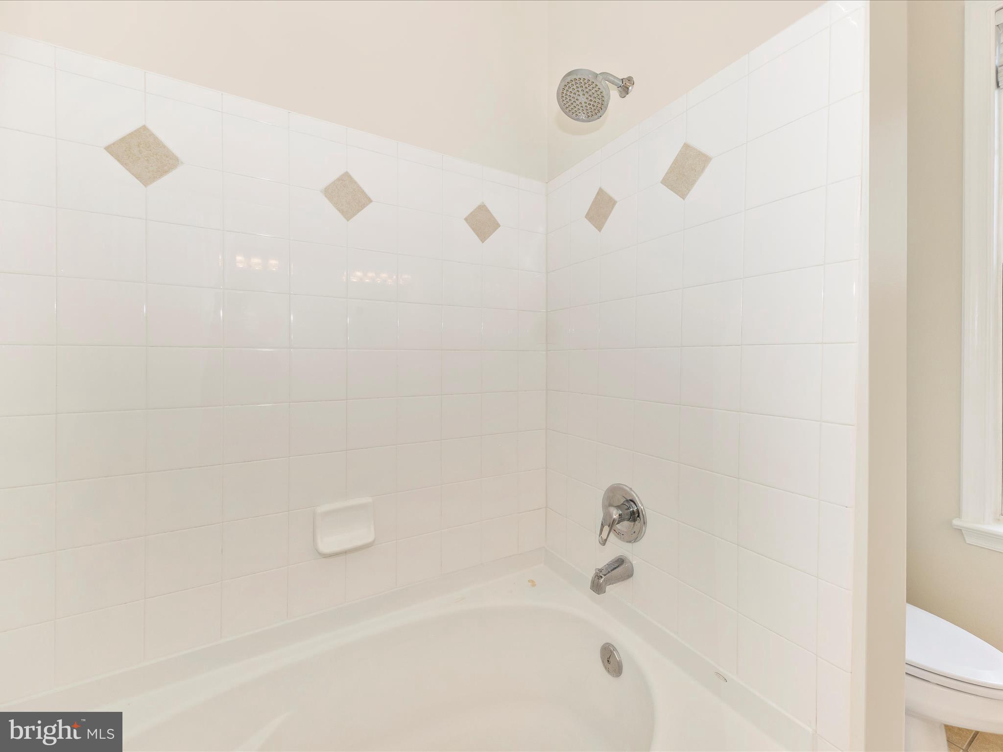 7 Booth Street, Unit 201 Gaithersburg, MD 20878 - Photo 27 of 67 a bathroom with a bathtub