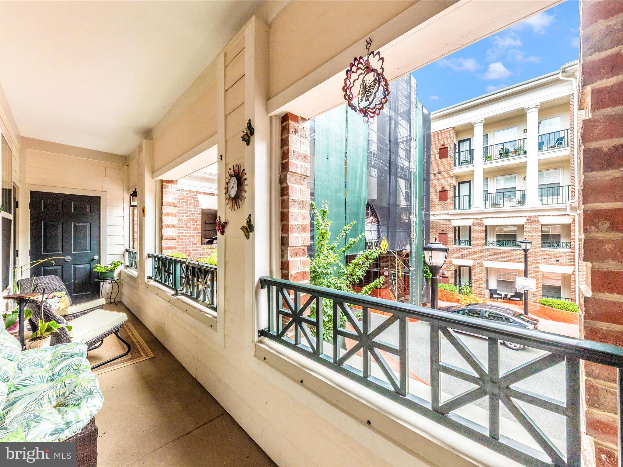 7 Booth Street, Unit 201 Gaithersburg, MD 20878 - Photo 28 of 67 a view of a balcony with chairs