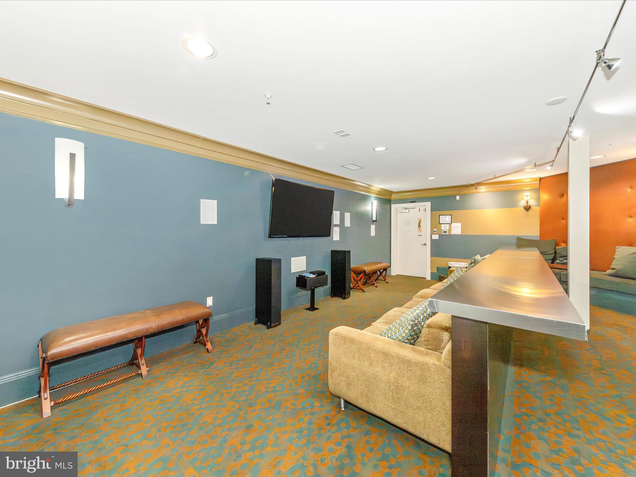 7 Booth Street, Unit 201 Gaithersburg, MD 20878 - Photo 32 of 67 a living room with furniture and a flat screen tv