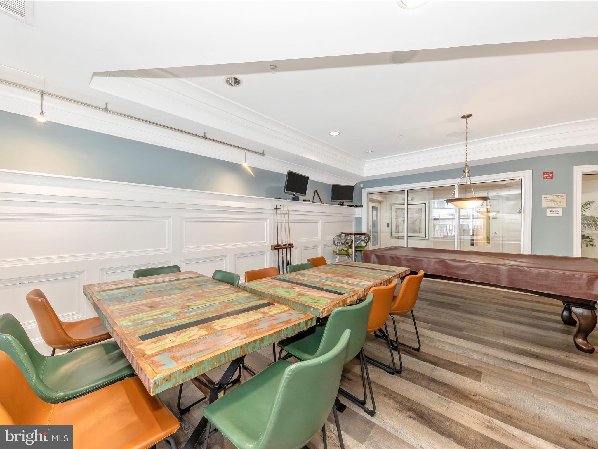 7 Booth Street, Unit 201 Gaithersburg, MD 20878 - Photo 42 of 67 a table and chairs in a room