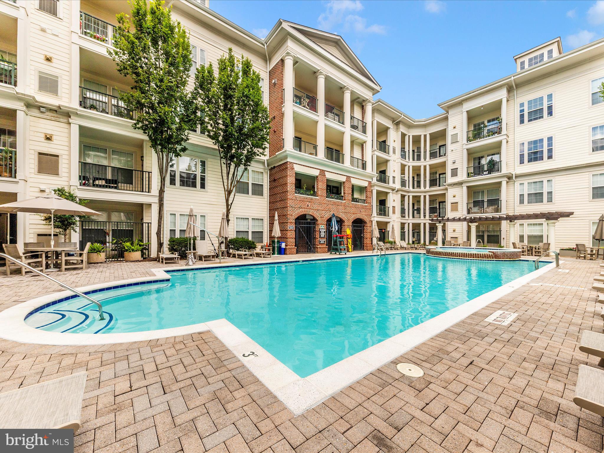 7 Booth Street, Unit 201 Gaithersburg, MD 20878 - Photo 45 of 67 a view of a building with a swimming pool