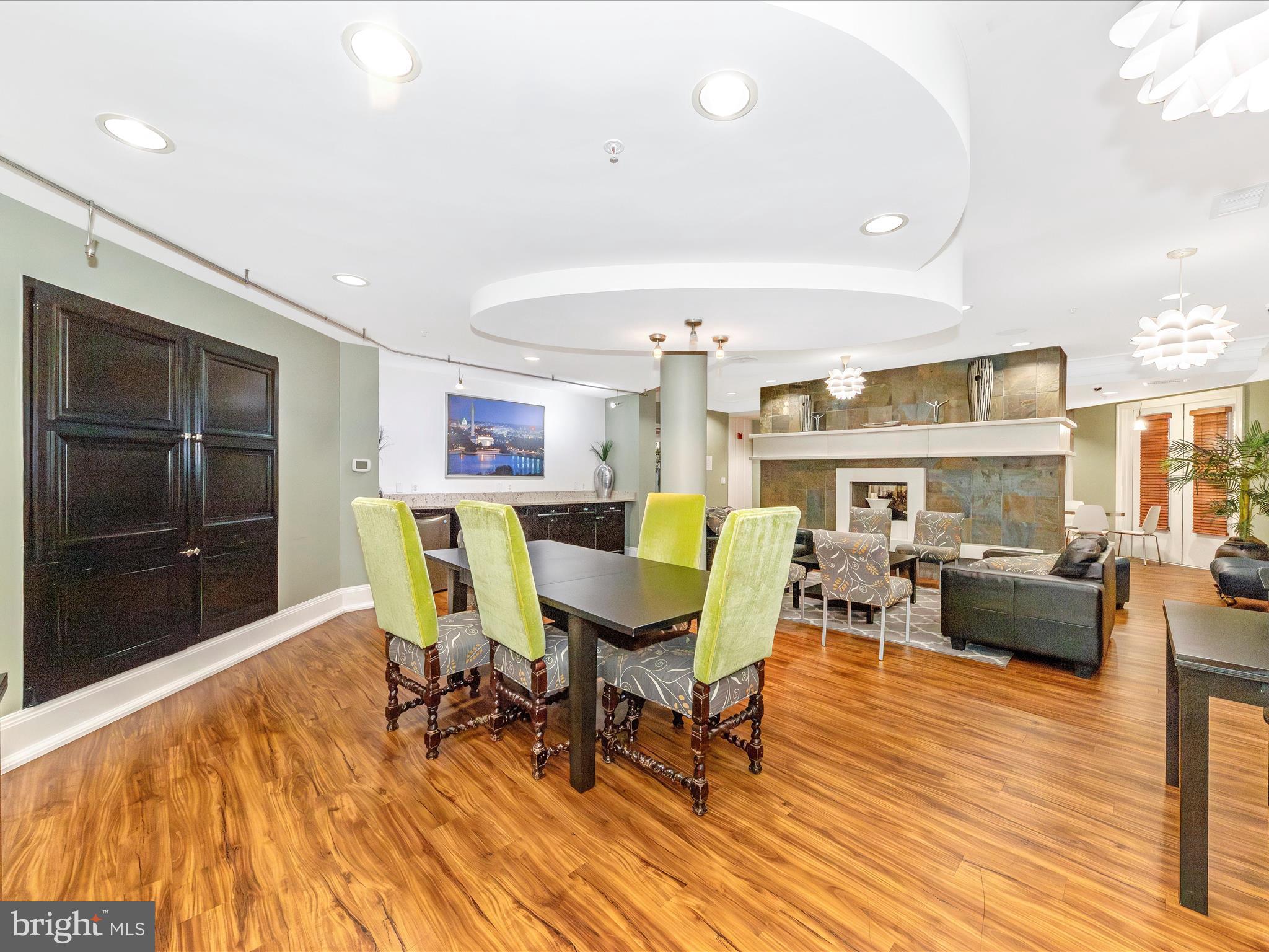 7 Booth Street, Unit 201 Gaithersburg, MD 20878 - Photo 48 of 67 a living room with furniture a rug and a flat screen tv