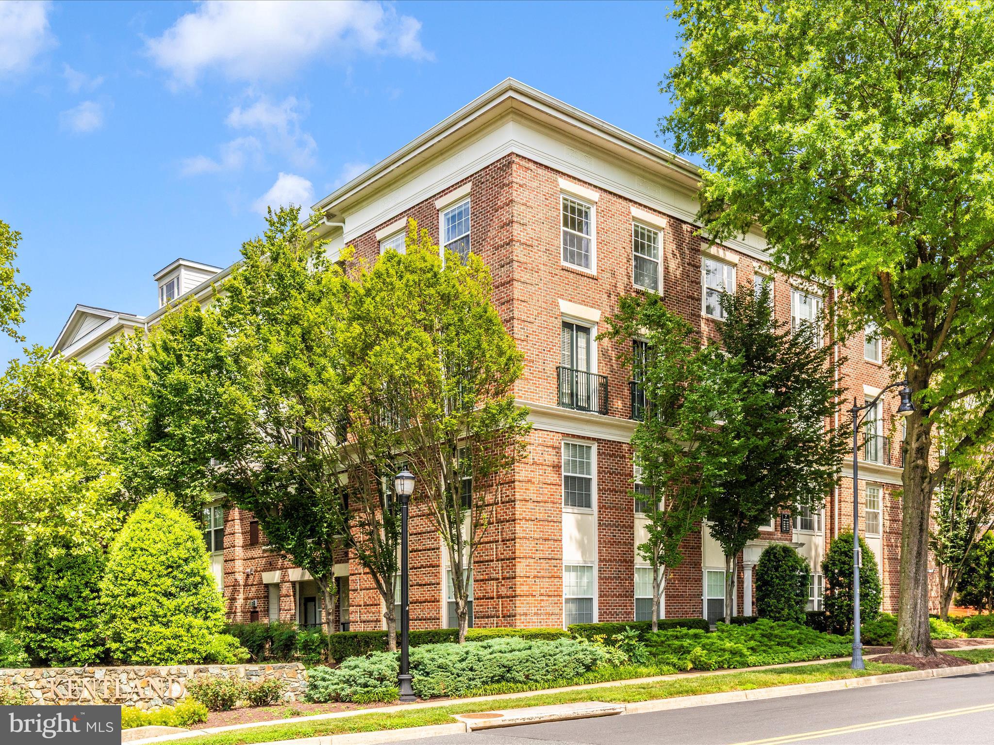 7 Booth Street, Unit 201 Gaithersburg, MD 20878 - Photo 52 of 67 a front view of a house with a yard