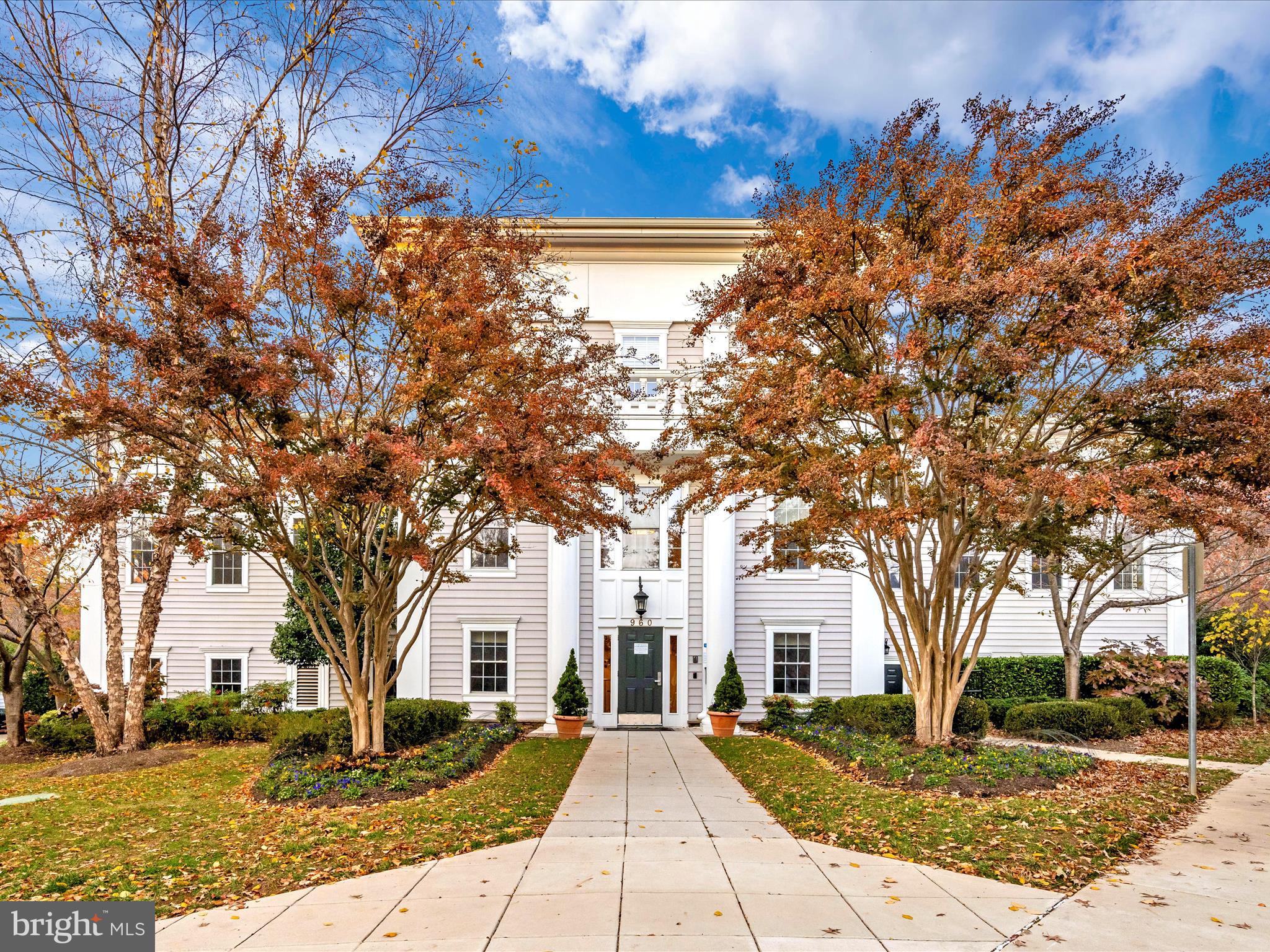 7 Booth Street, Unit 201 Gaithersburg, MD 20878 - Photo 58 of 67 a front view of a house with a yard
