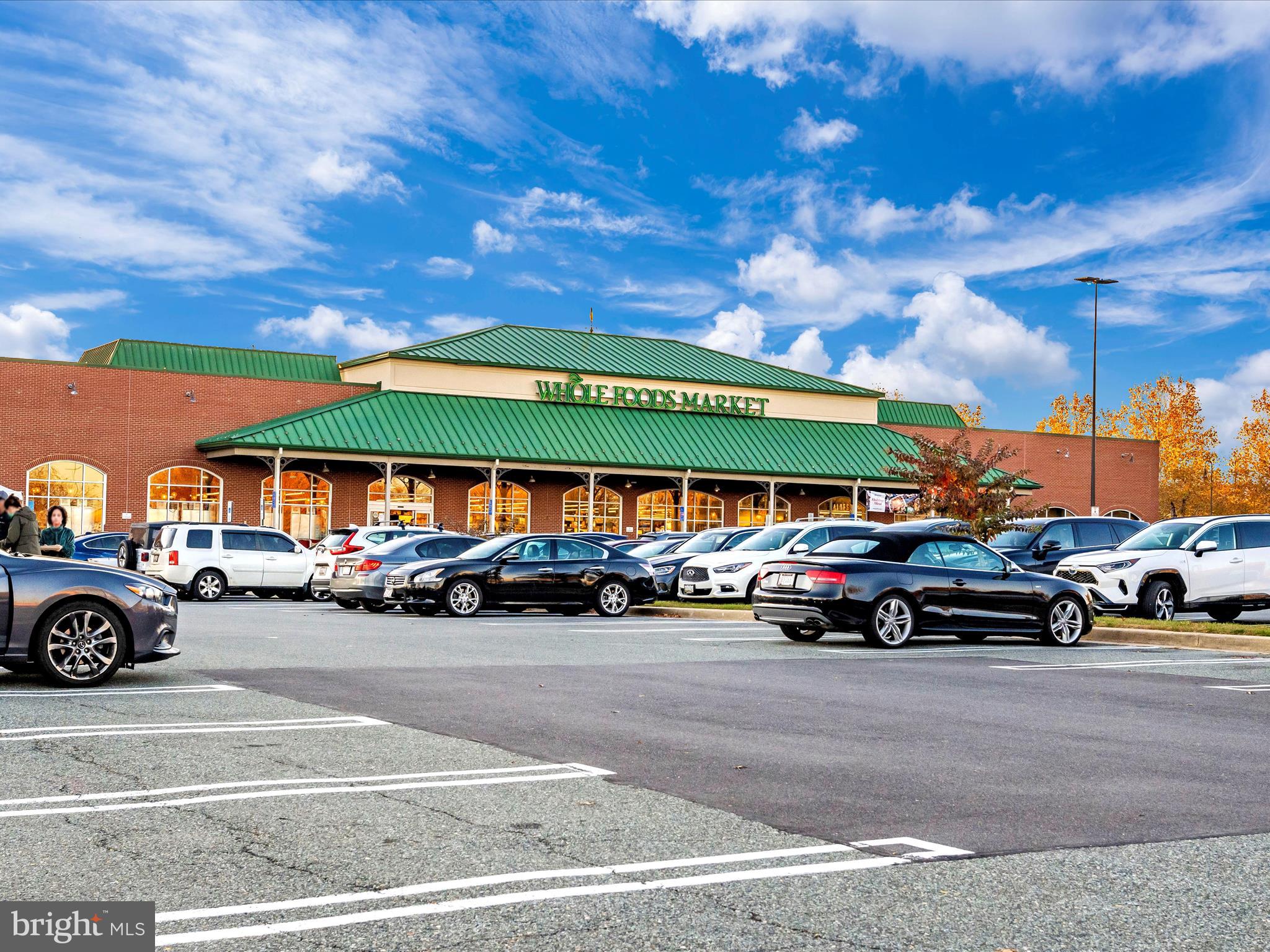 7 Booth Street, Unit 201 Gaithersburg, MD 20878 - Photo 63 of 67 a parked cars is parked in front of a building