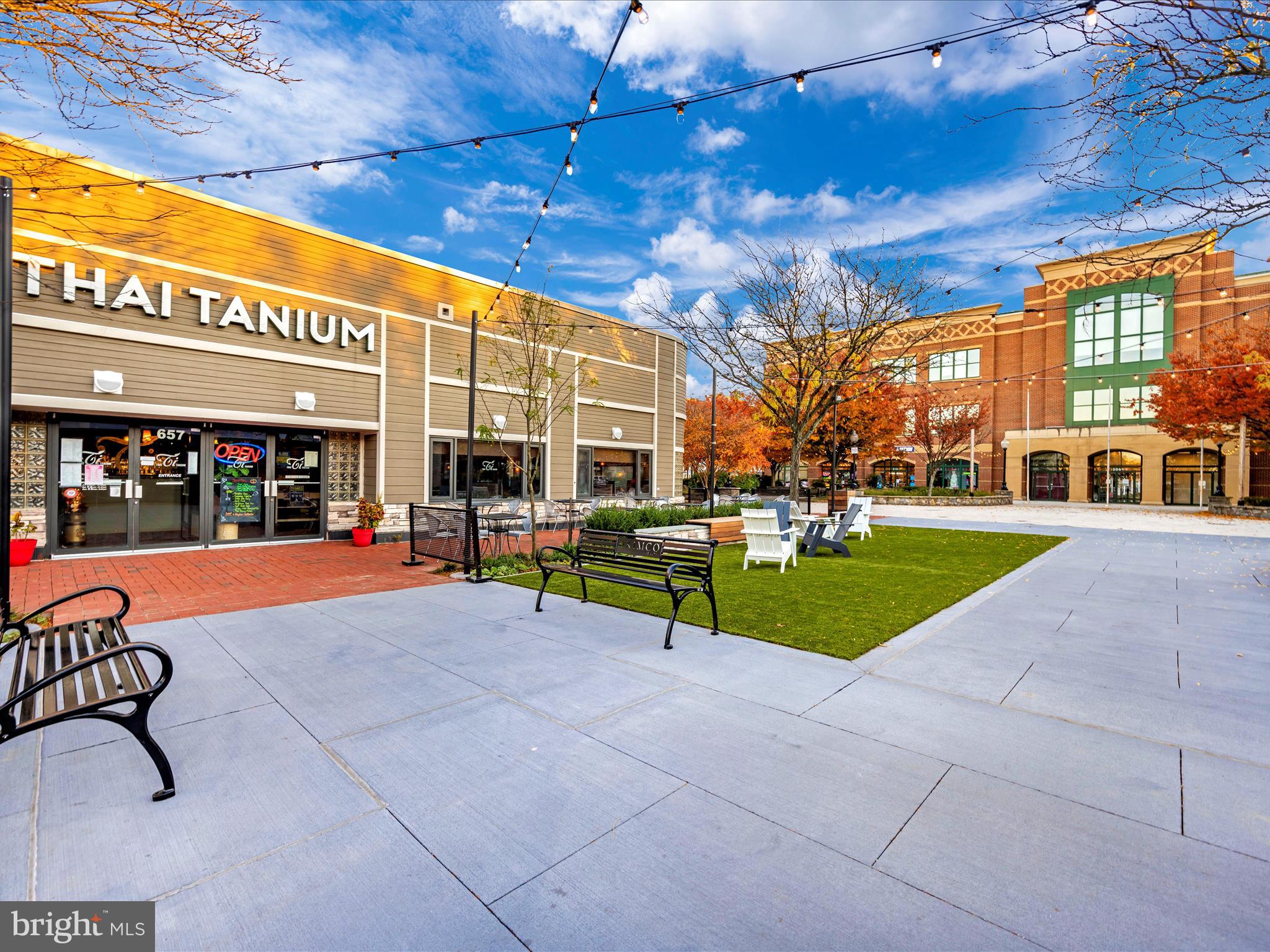7 Booth Street, Unit 201 Gaithersburg, MD 20878 - Photo 65 of 67 a view of an chairs and tables in the patio