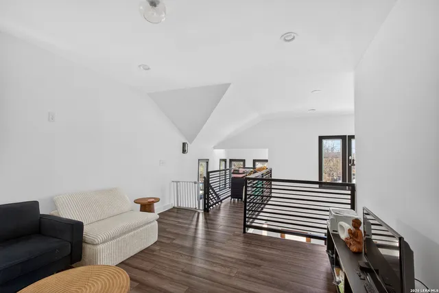 a workspace with furniture and ceiling fan