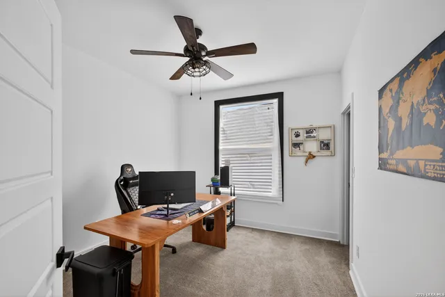 a view of a workspace with furniture and closet