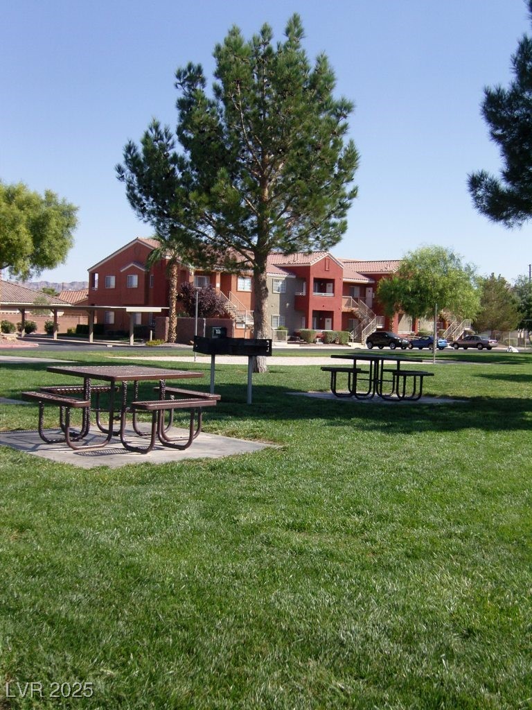 4730 East Craig Road, Unit 2093 Las Vegas, NV 89115 - Photo 7 of 10 Surrounding community with a yard