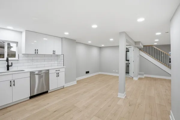 a kitchen with stainless steel appliances granite countertop a refrigerator sink and cabinets