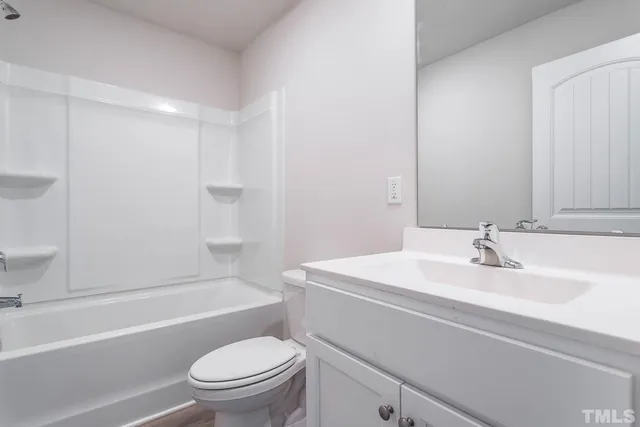 a bathroom with a sink a toilet and a bathtub