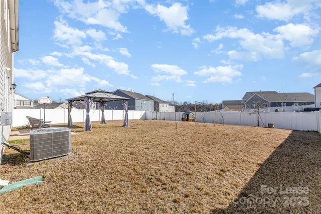 a view of a house with a snow in the yard