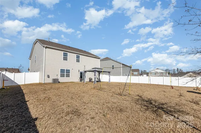 a view of a house with a snow yard and covered with snow