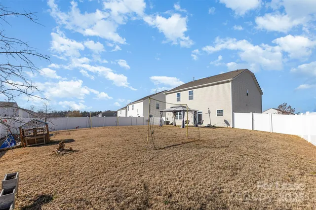 an aerial view of a house with a swimming pool