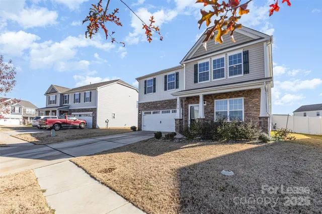 a view of multiple houses with a street