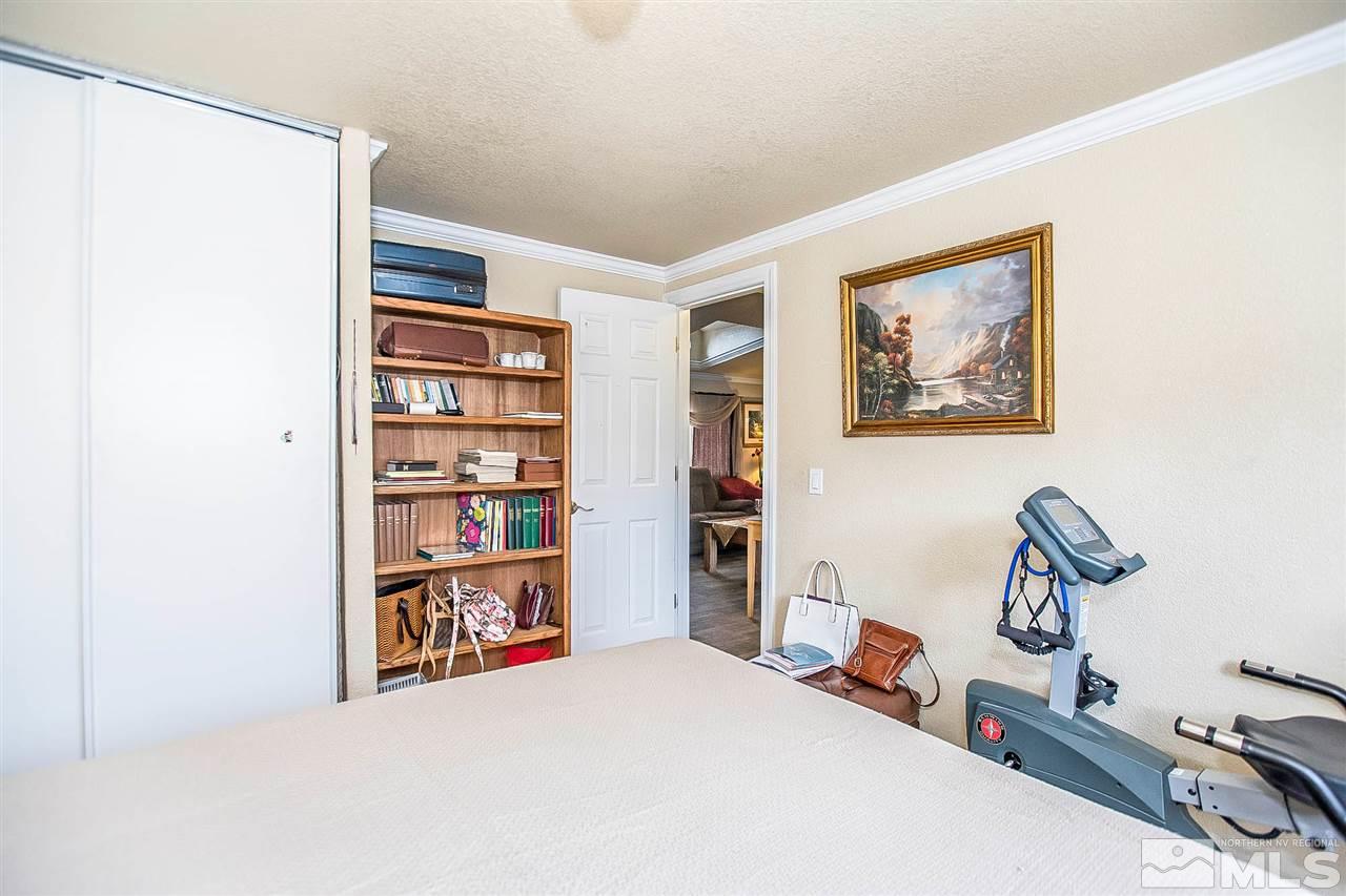 2735 Snapdragon Way Reno, NV 89512 - Photo 12 of 18 a room with a bed and a book shelf