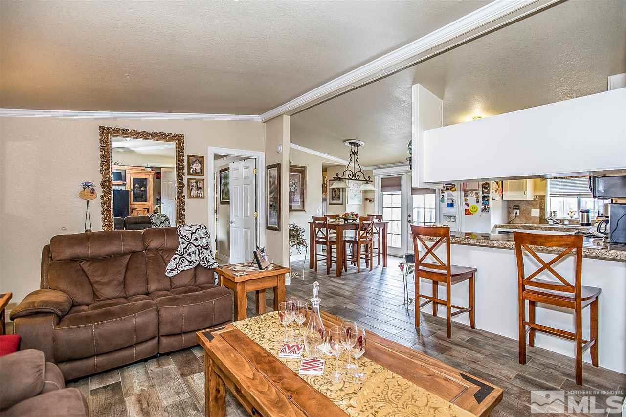 2735 Snapdragon Way Reno, NV 89512 - Photo 9 of 18 a living room with furniture wooden floor and a table