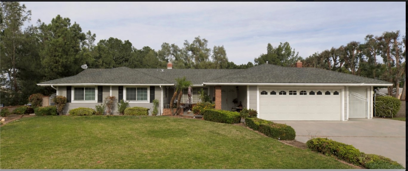 7110 Saw Mill Road Corona, CA 92881 - Photo 1 of 1 a front view of a house with garden