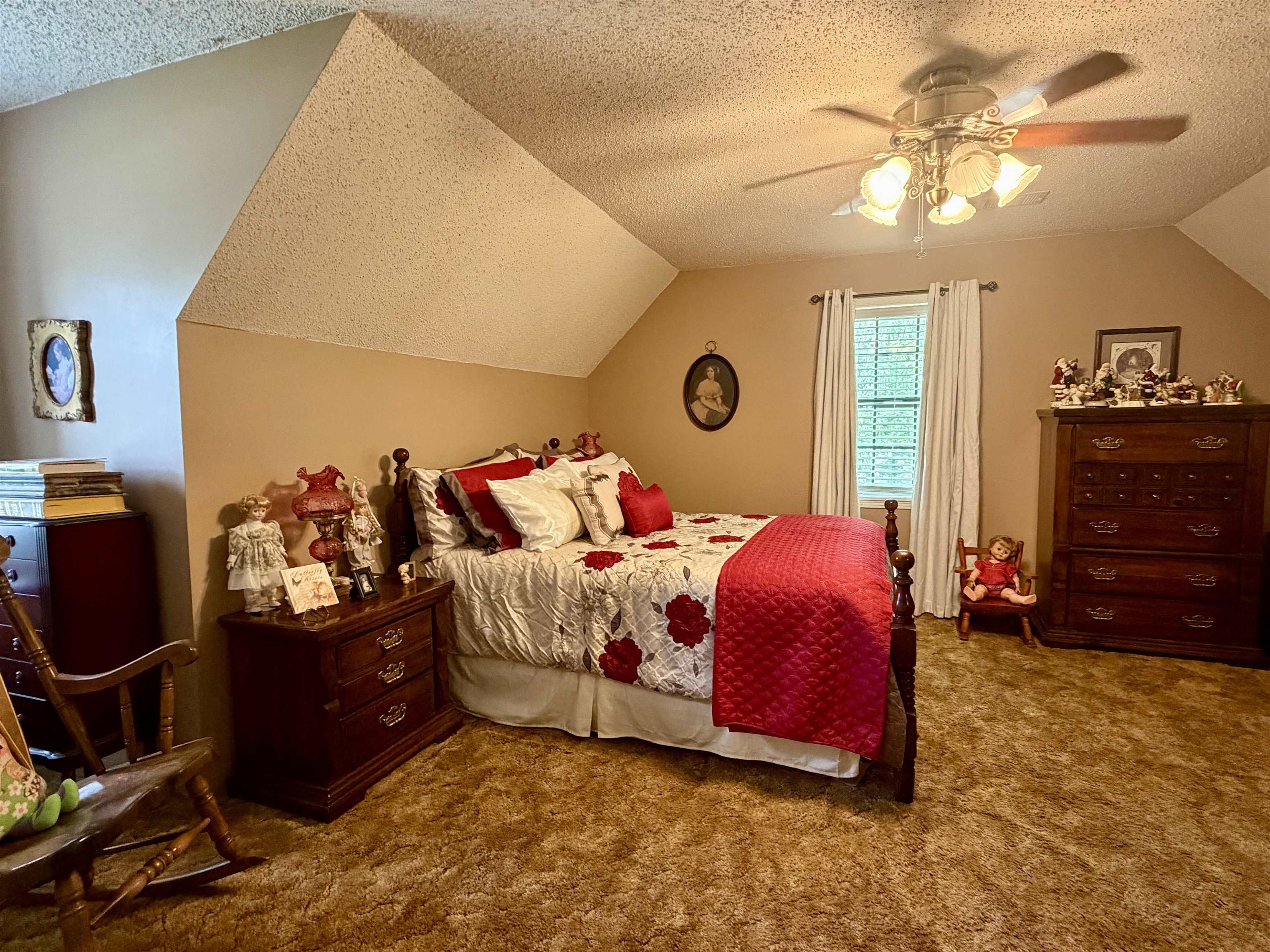 142 Treece Street Selmer, TN 38375 - Photo 22 of 36 Attic bedroom featuring sloped ceilings, a window with blinds and curtains, and wall-to-wall carpeting