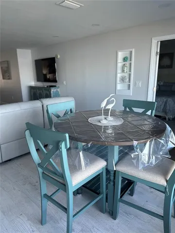 a workspace with furniture and a flat screen tv